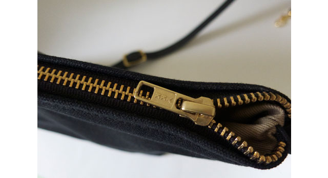 Photo closeup of high quality, solid brass zipper.